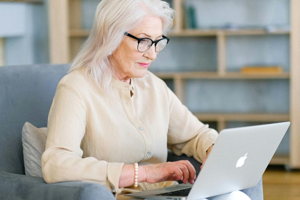 An Elderly Woman using a Laptop