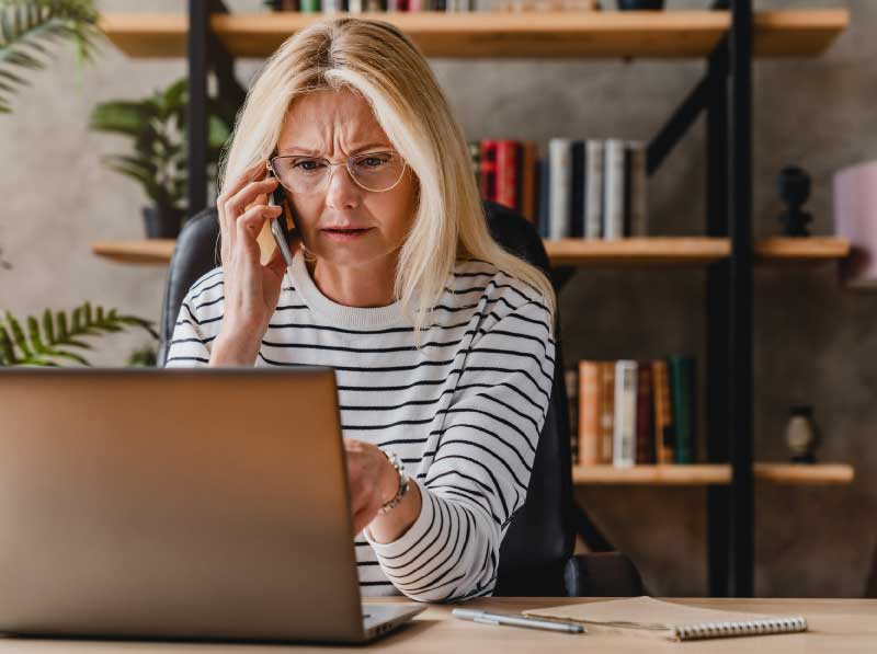 upset-lady-on-the-phone-with-laptop